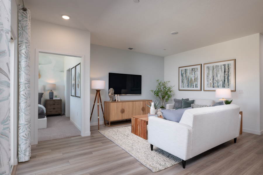 A living room with a white couch.