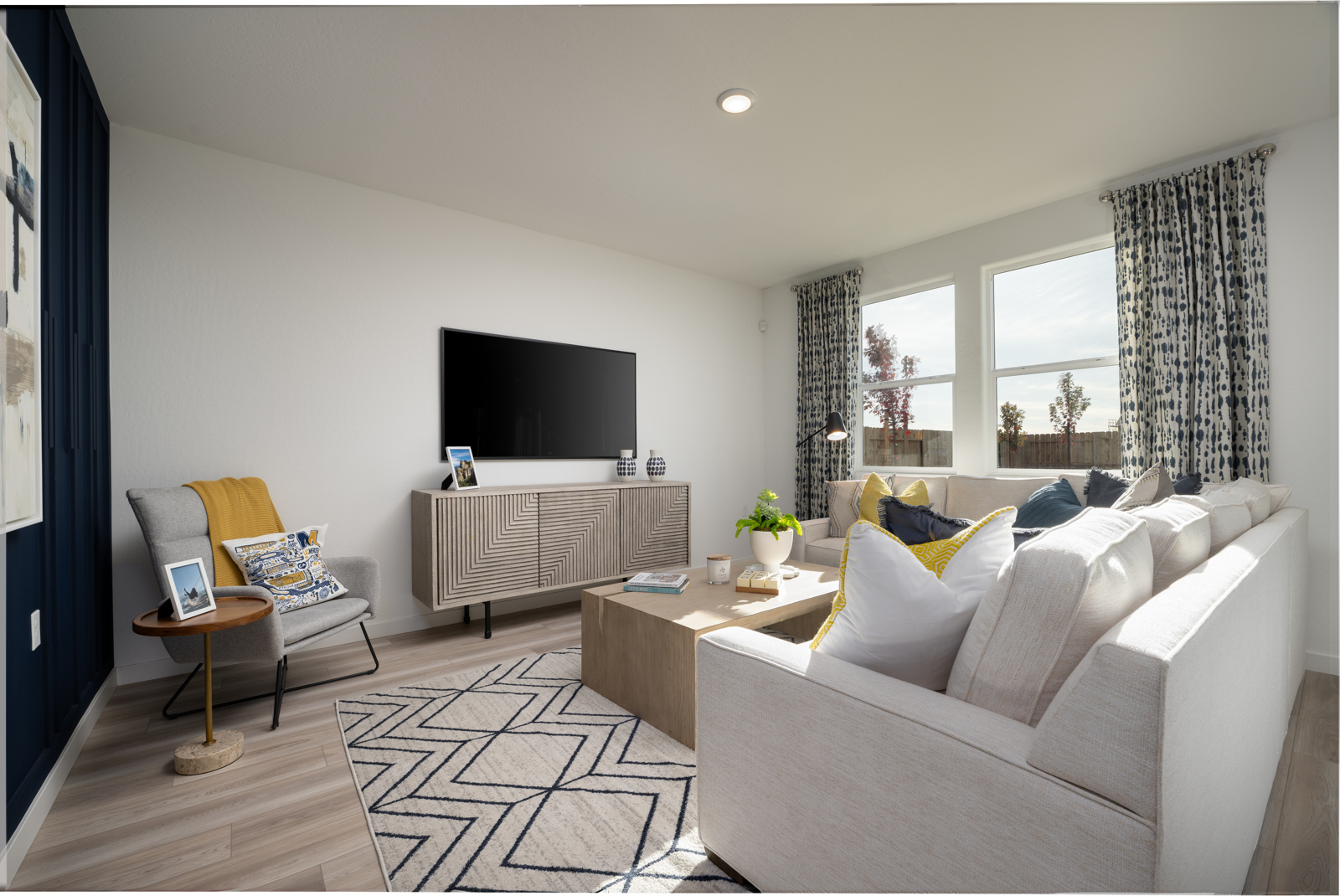 A living room with a tv and couches.