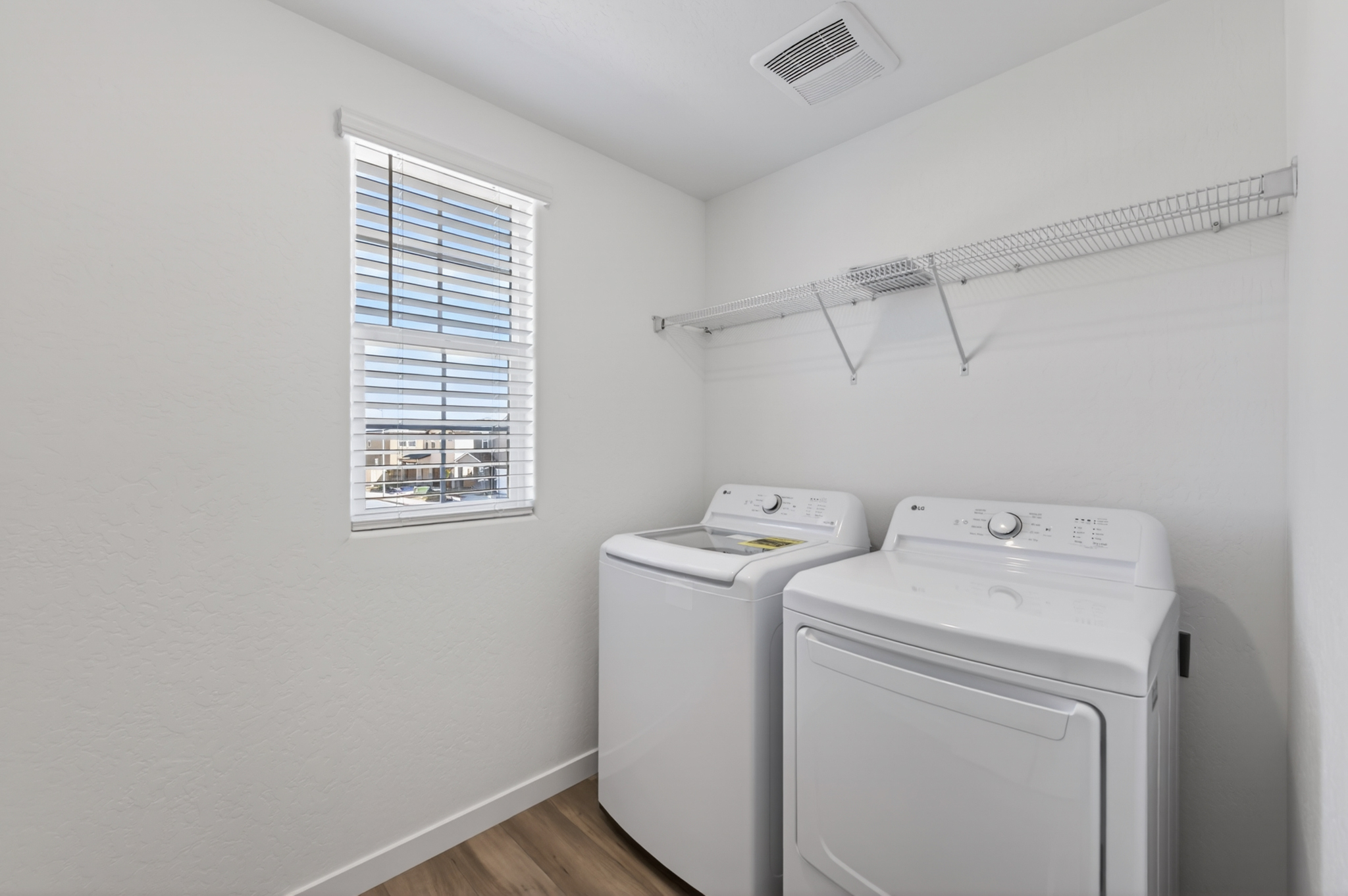 A washing machine in a room.