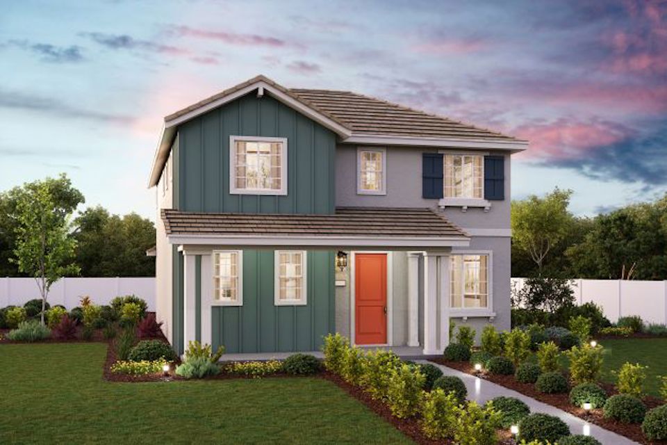 A house with a green lawn.
