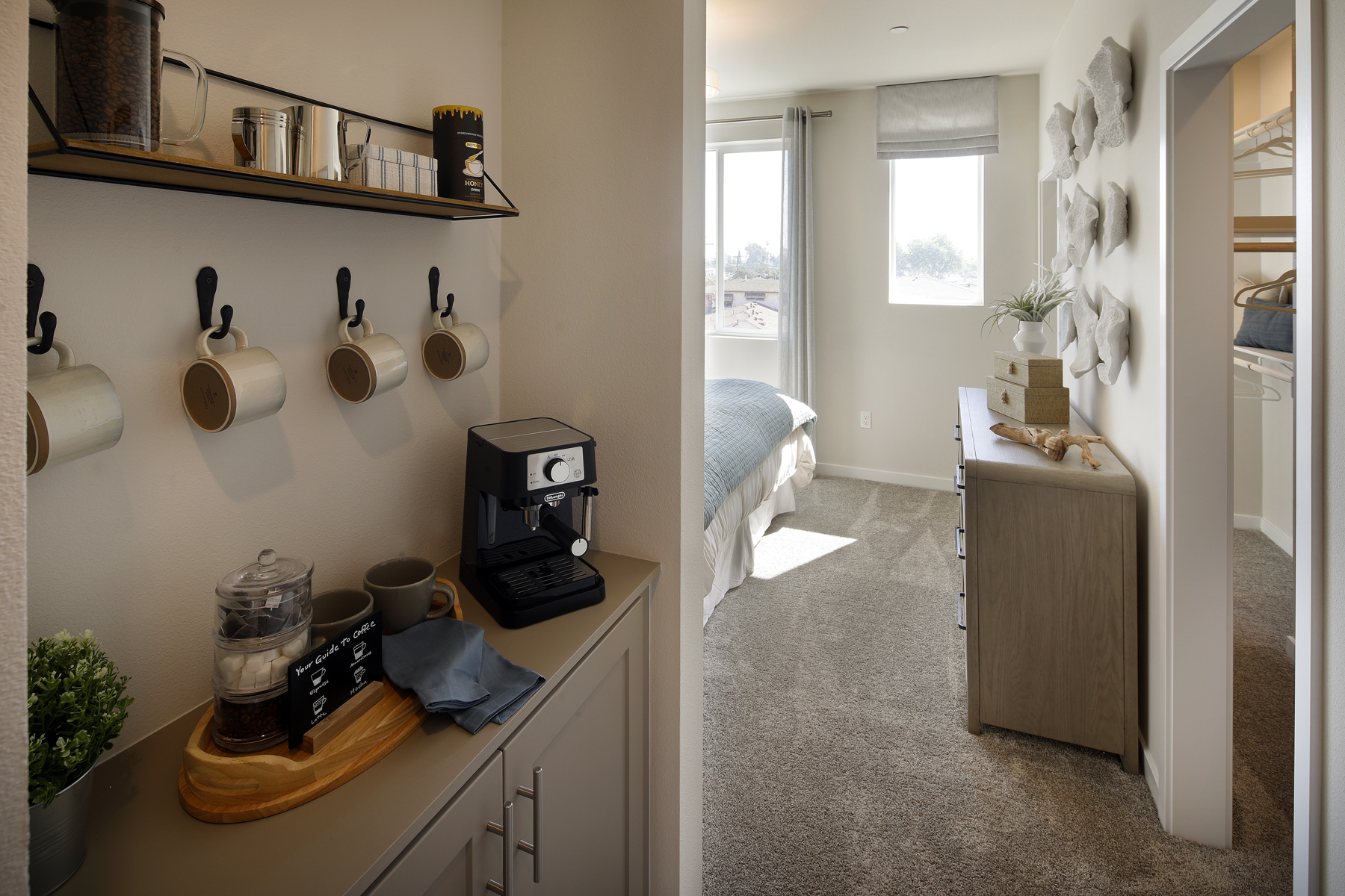 A room with a desk and shelves.