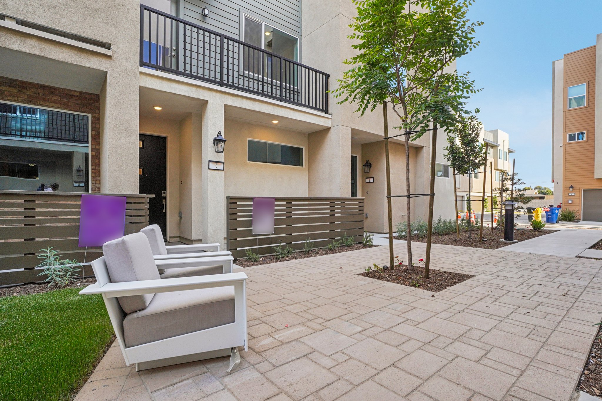 A white chair outside a building.