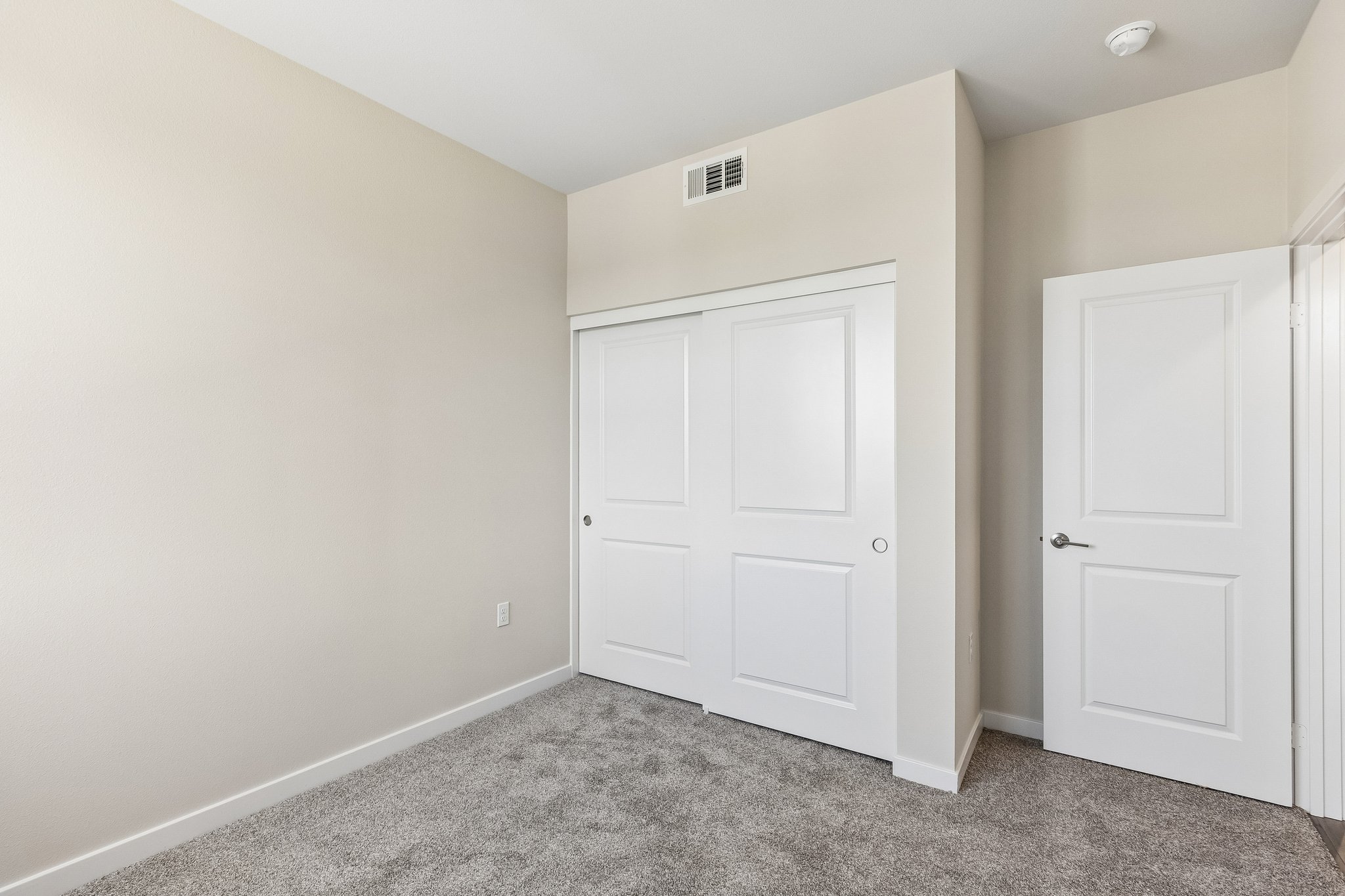 A room with white doors.