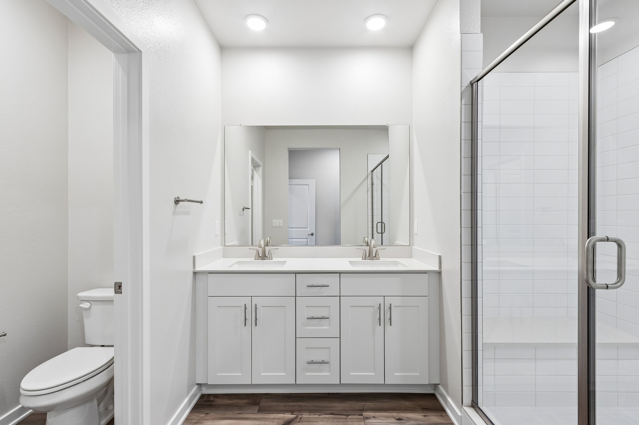 A bathroom with a glass shower.