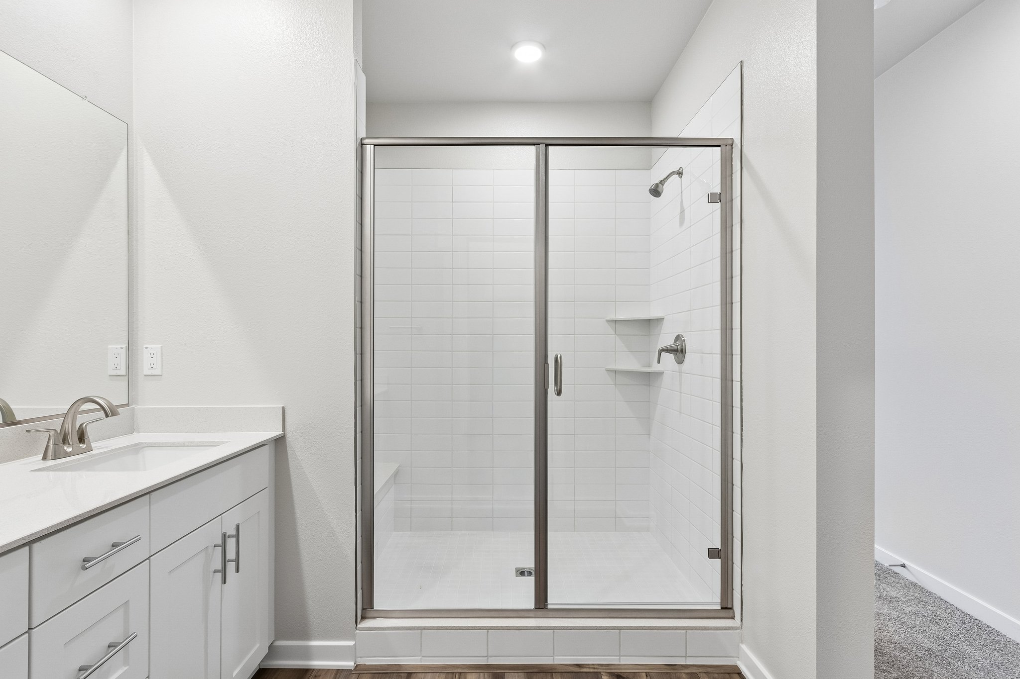 A bathroom with a glass shower.