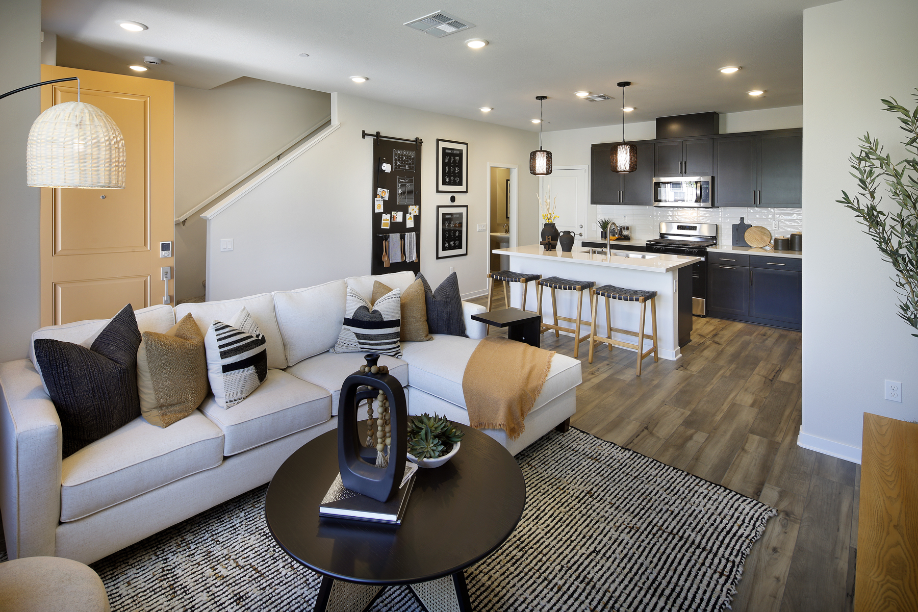 A living room with a couch and a table.