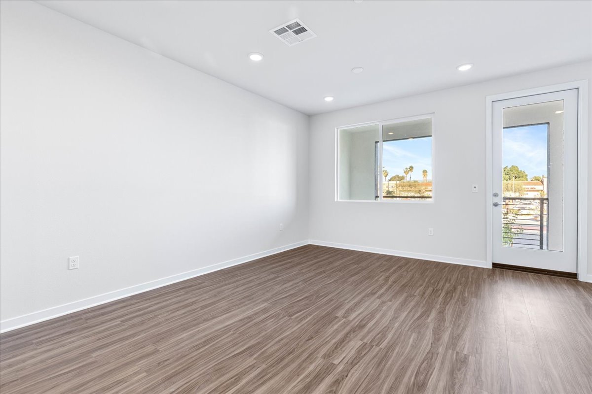 A room with a wood floor and a wood floor.