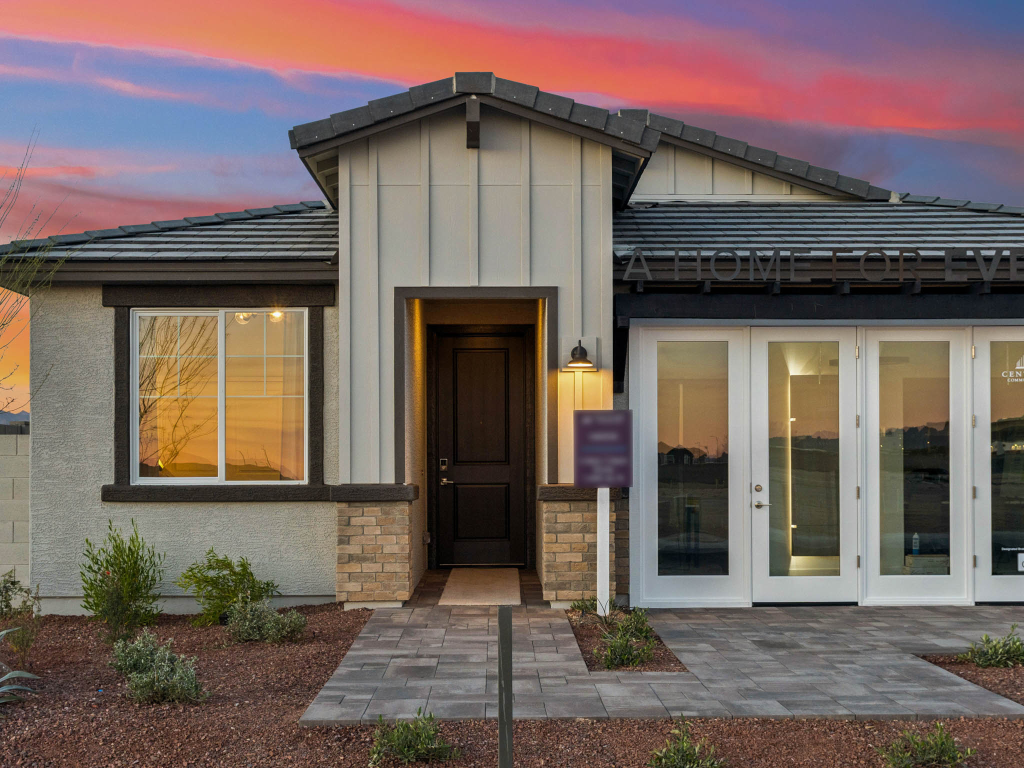 A house with a brick driveway.