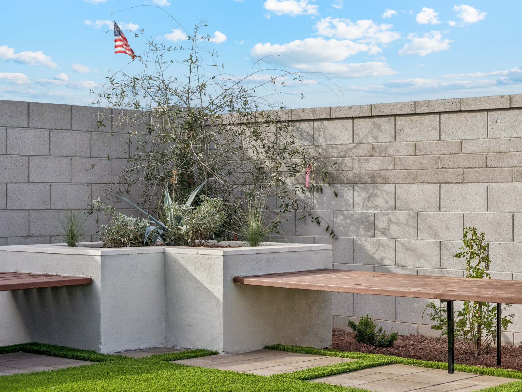 A stone wall with a flag.