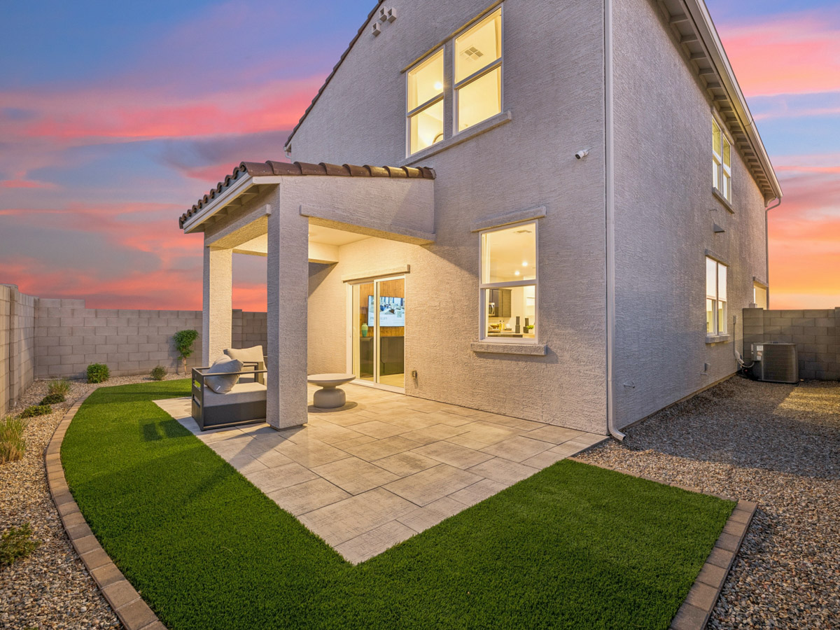 A house with a green lawn.