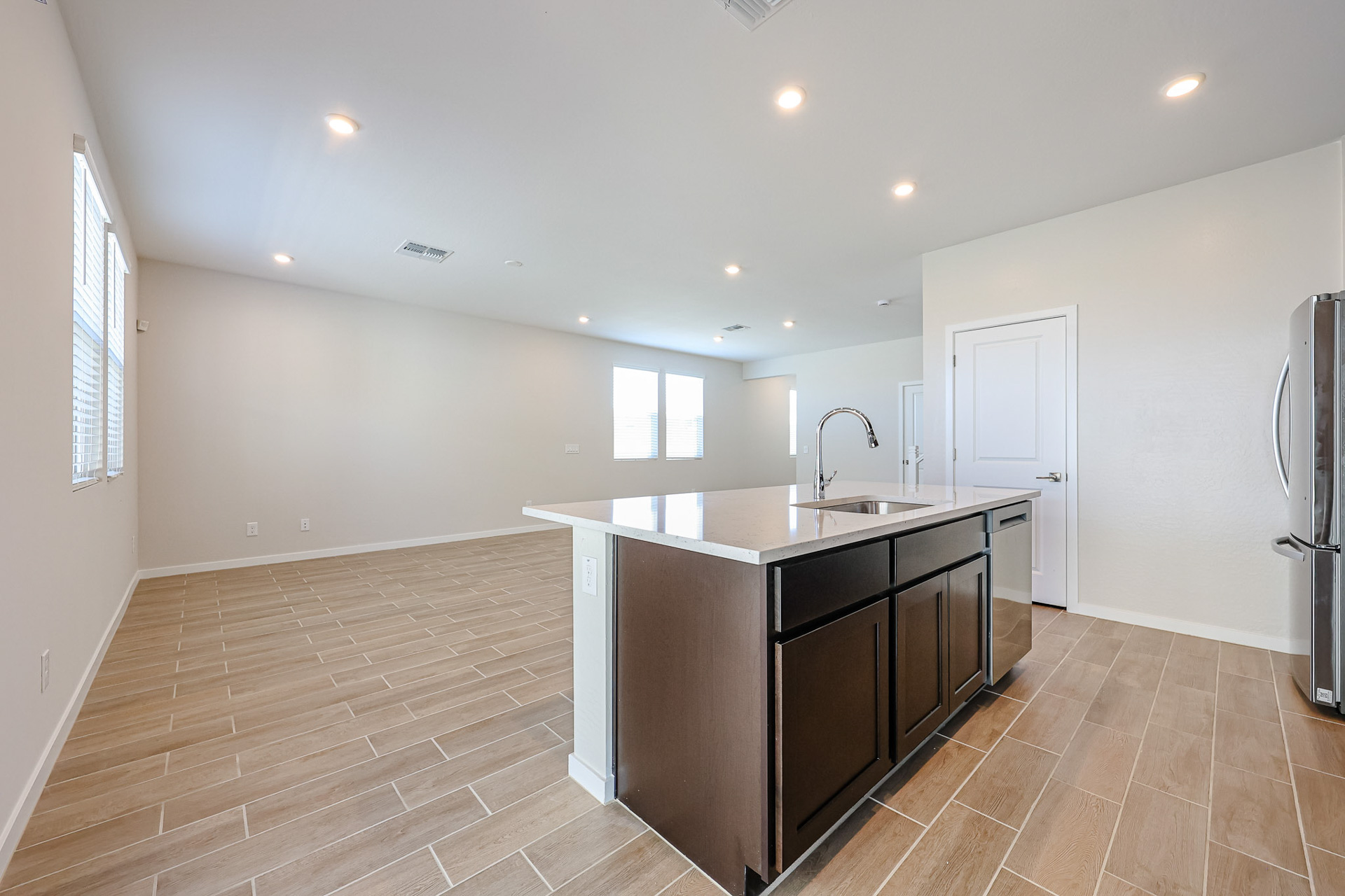 A kitchen with a wood floor.