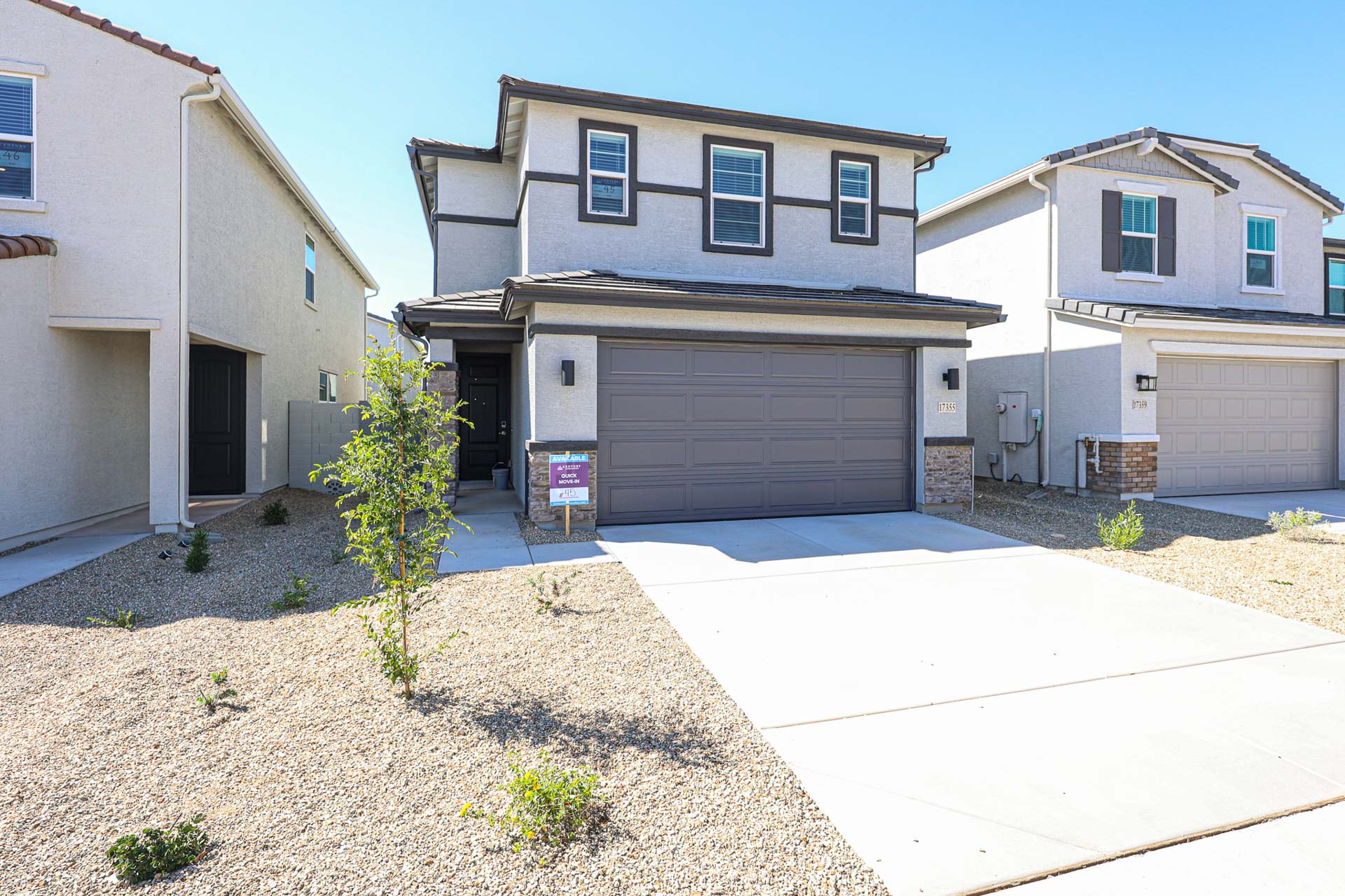 A building with garages and a driveway.