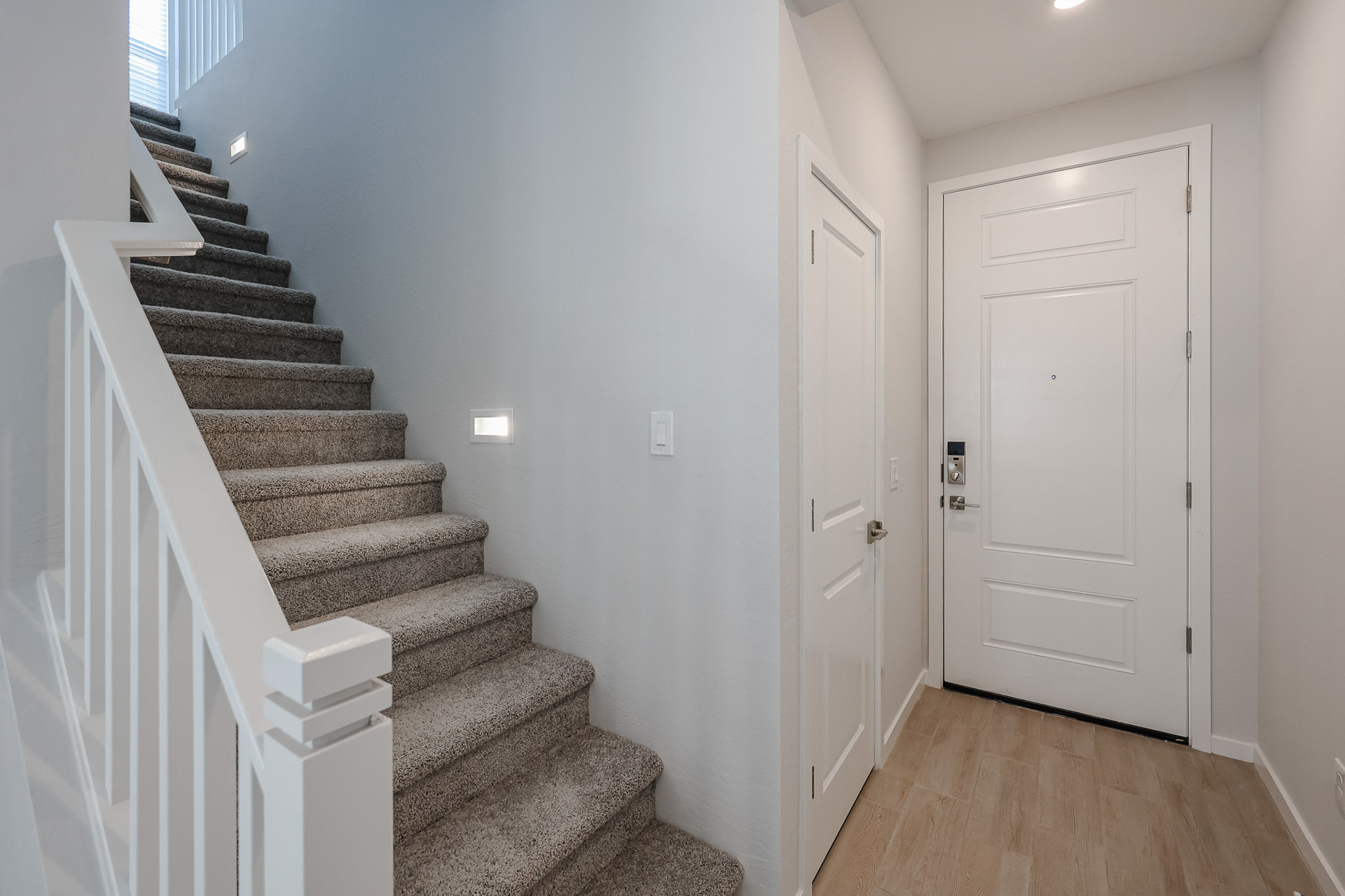 A staircase leading to a door.