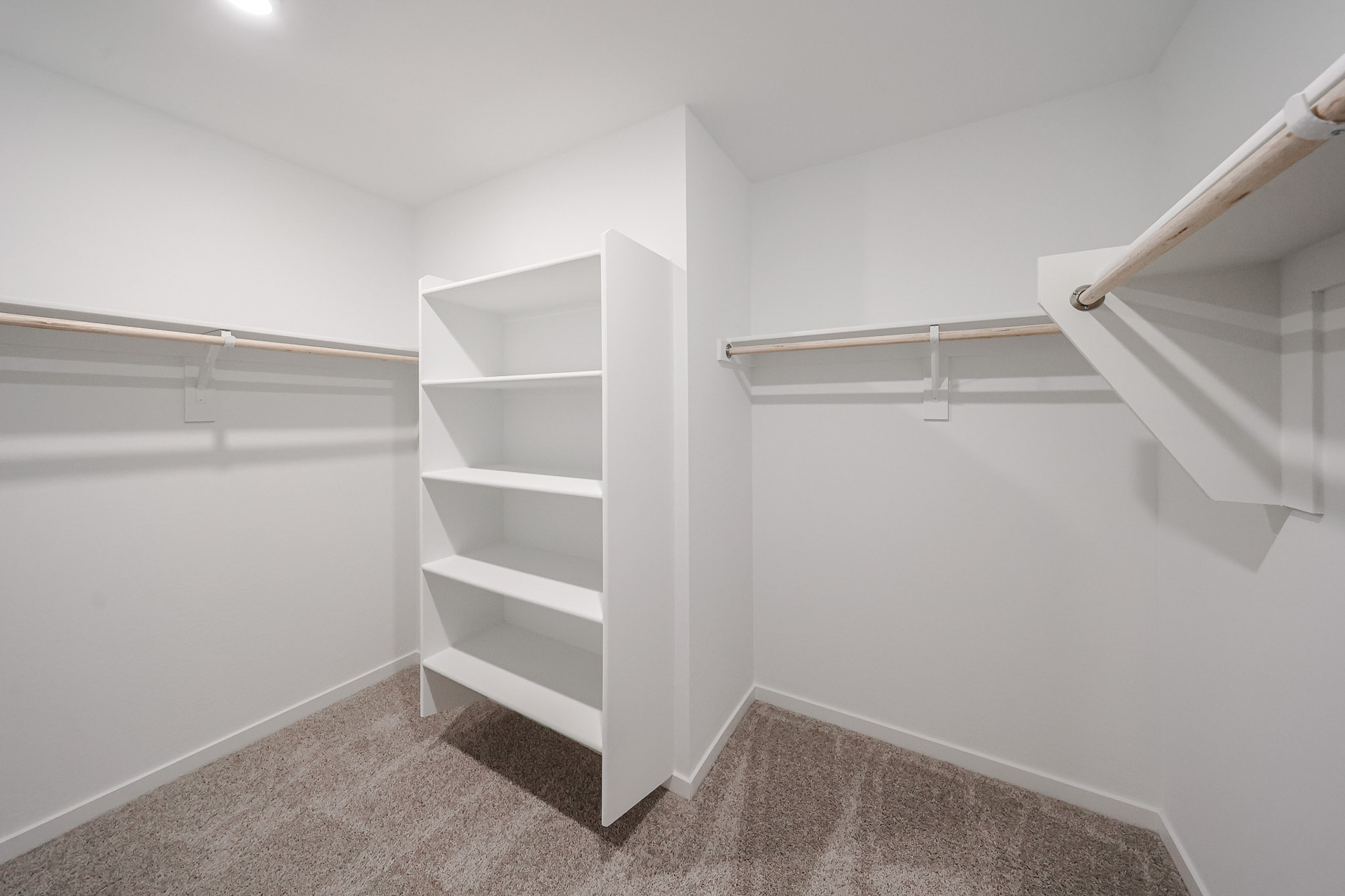 A white staircase in a room.
