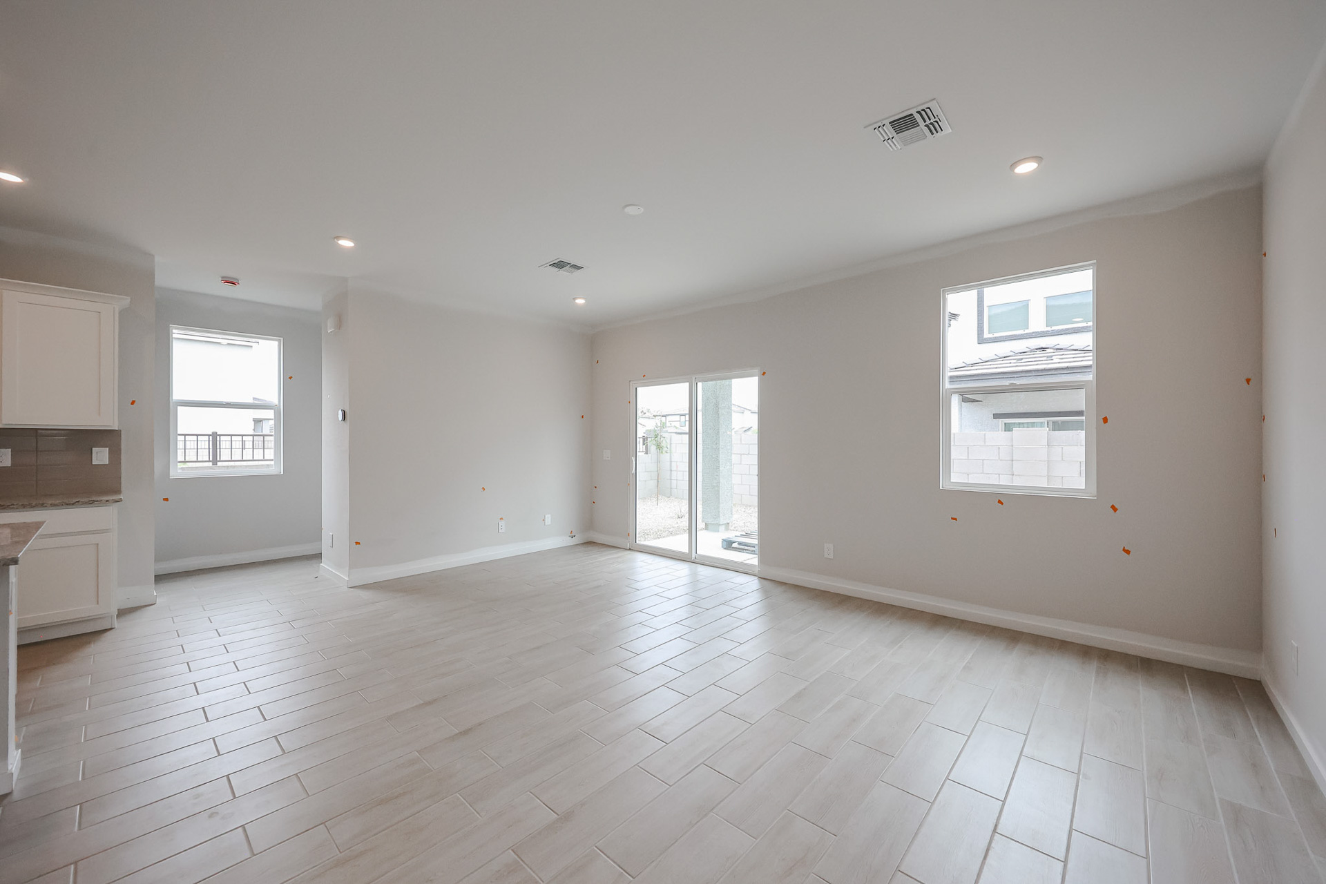 A room with white walls and windows.