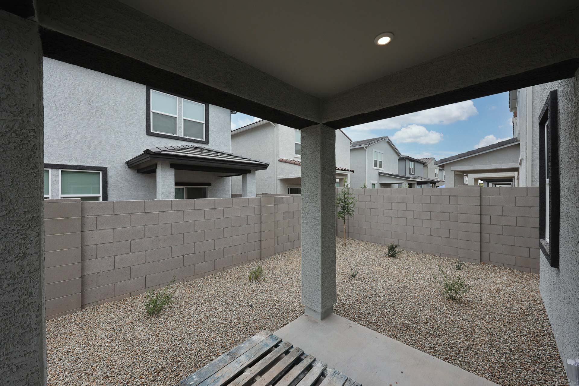 A building with a stone patio.