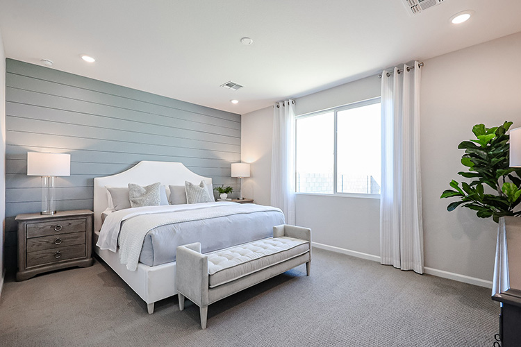 A bedroom with a bed and a couch.