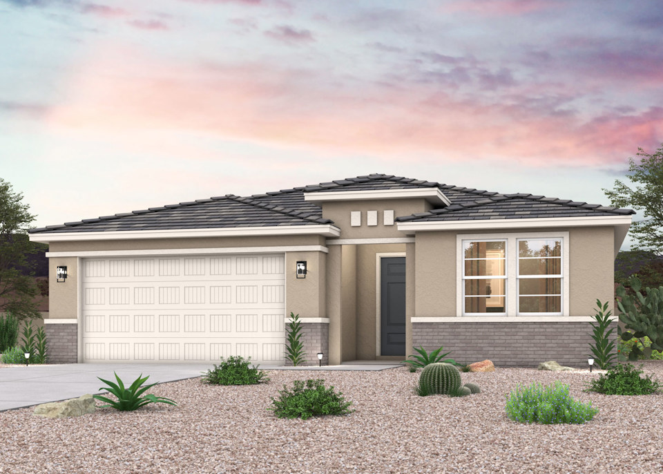 A house with desert landscape and a 2- car garage.