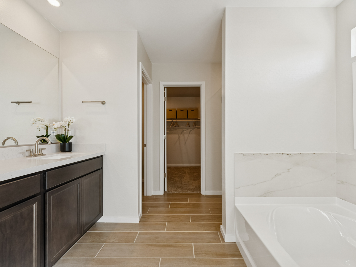 A bathroom with a tub and sink.
