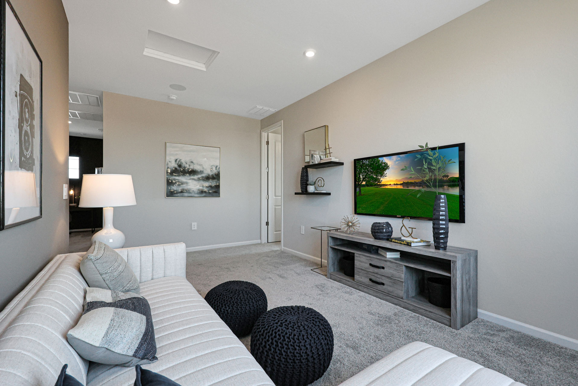 A living room with a tv and couches.