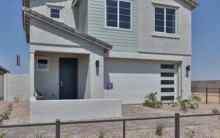 A house with a fence in front.