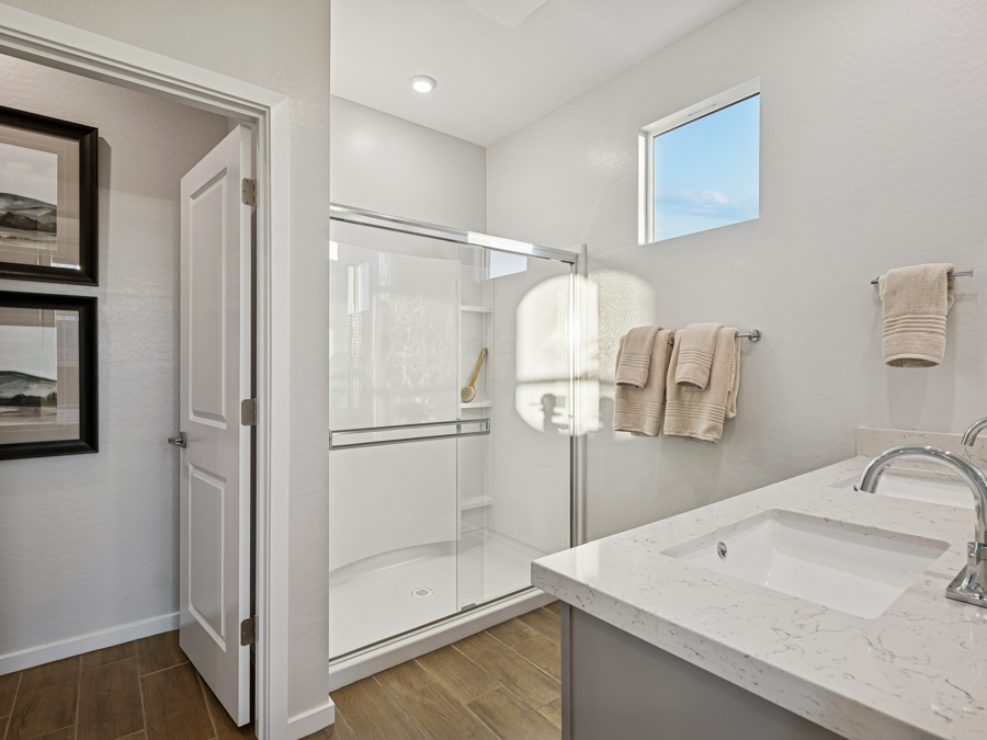 A bathroom with a glass shower.