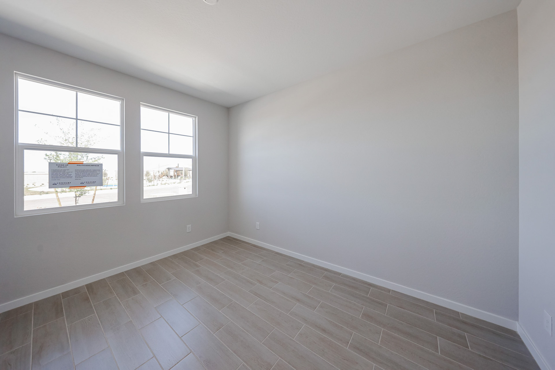 A room with windows and a sign.