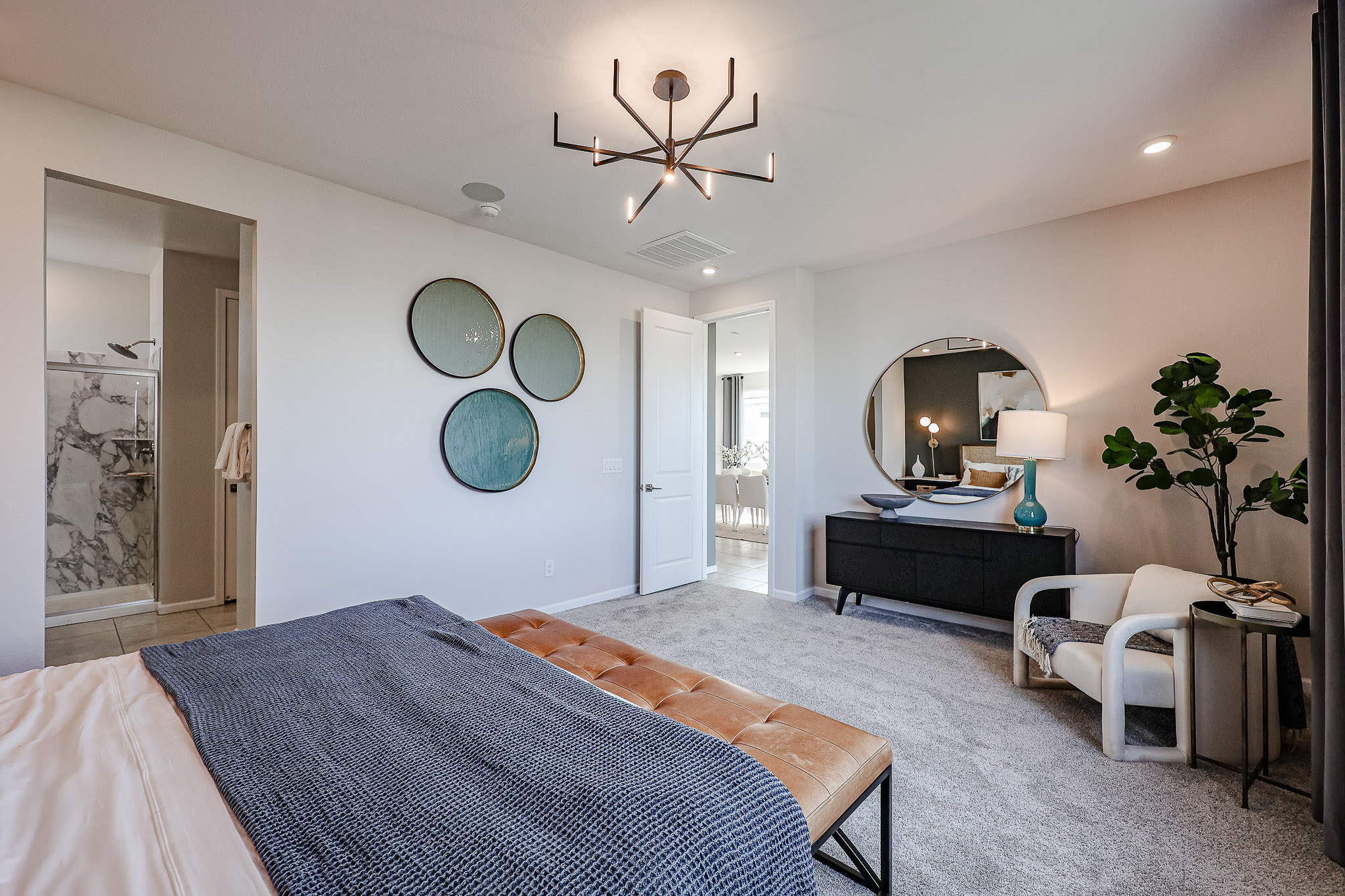 A bedroom with a bed and a couch.