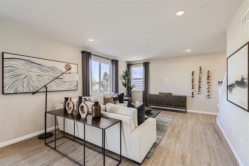 A living room with a white couch.