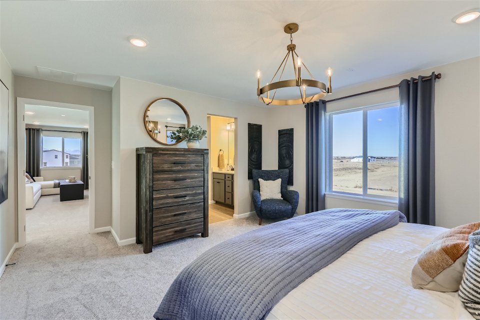 A bedroom with a large bed.