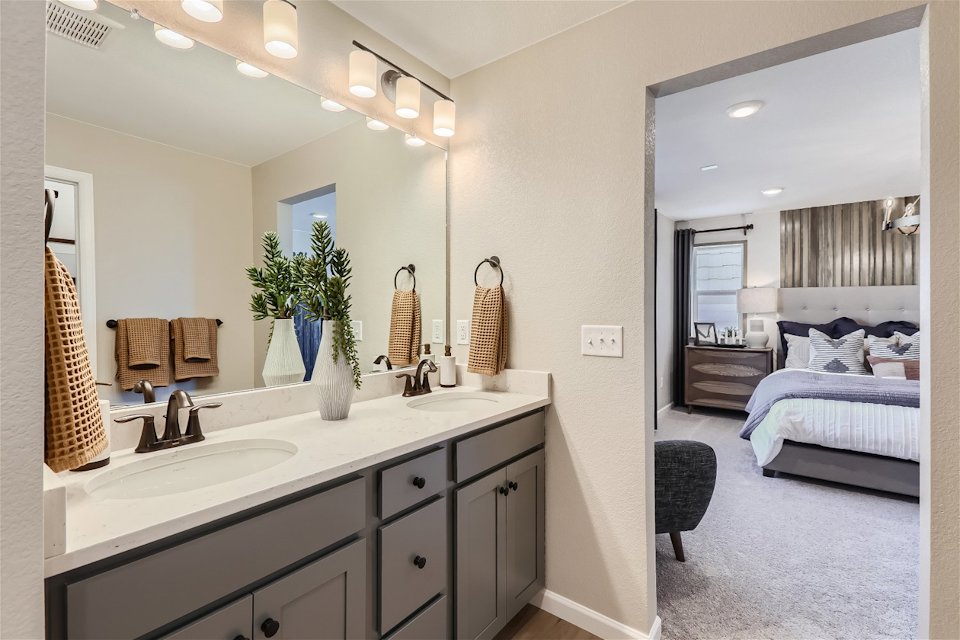 A bathroom with a large mirror.
