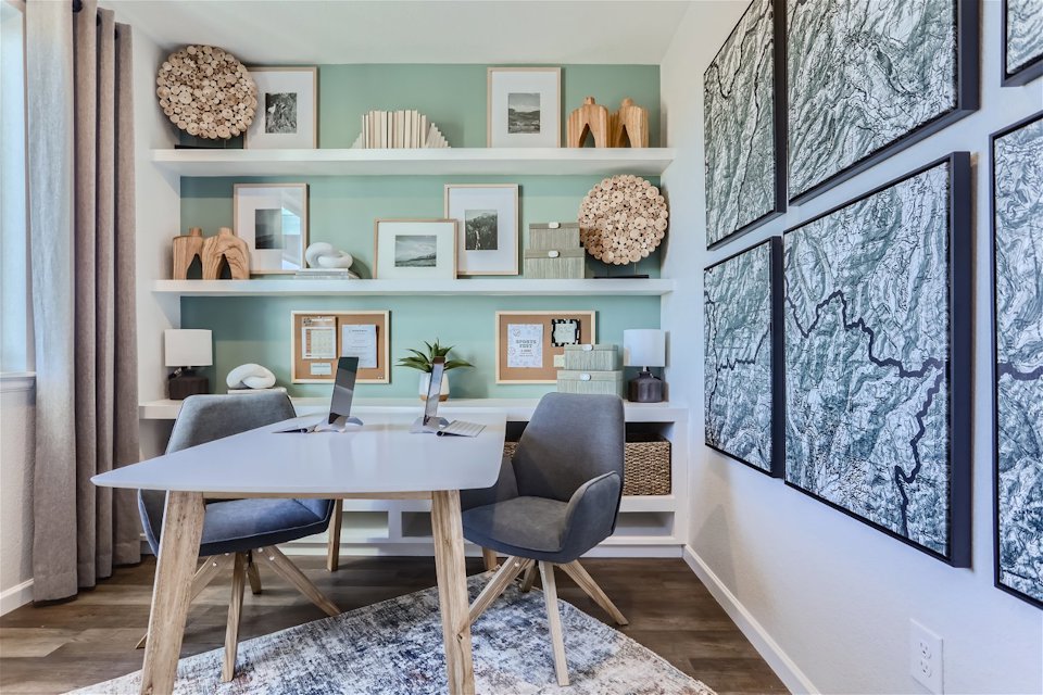 A room with a table and chairs.