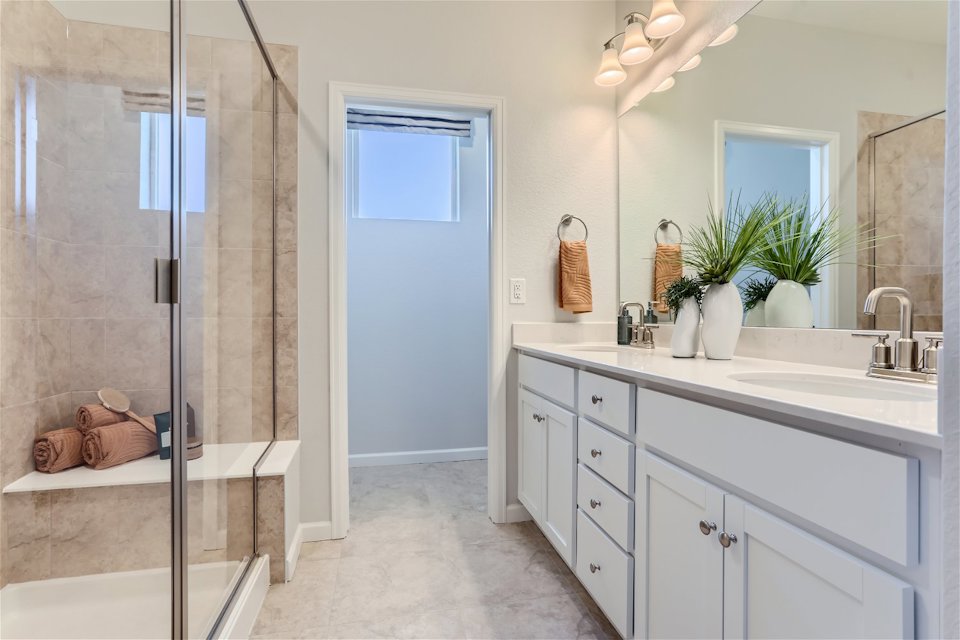 A bathroom with a glass shower.