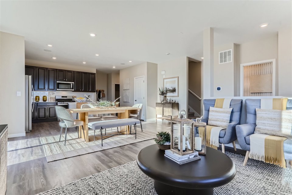 A large living room with a large kitchen and dining area.