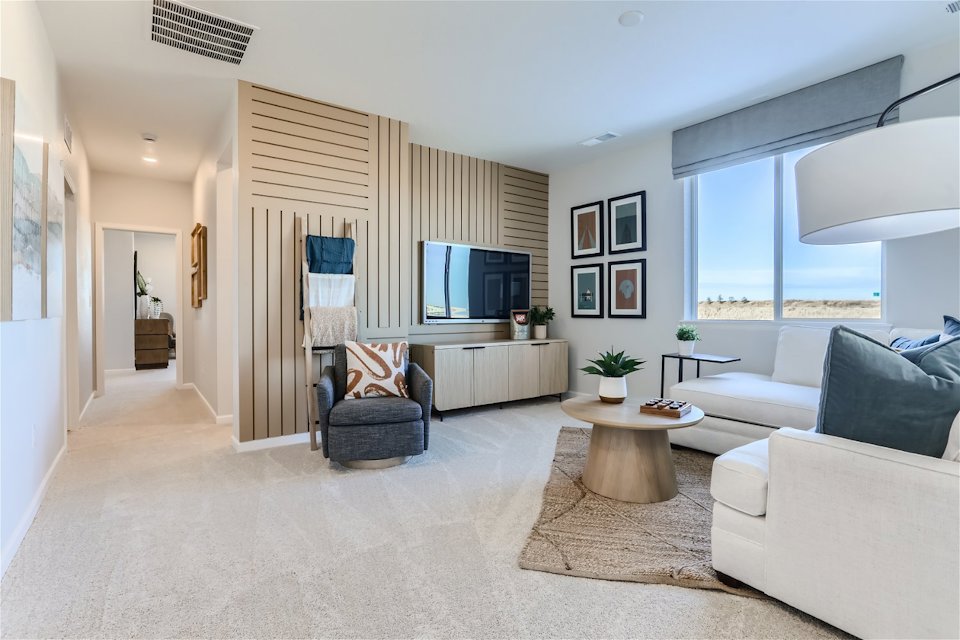 A living room with a tv and couches.