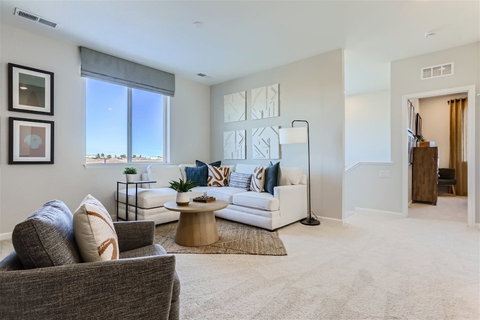 A living room with a couch and a coffee table.