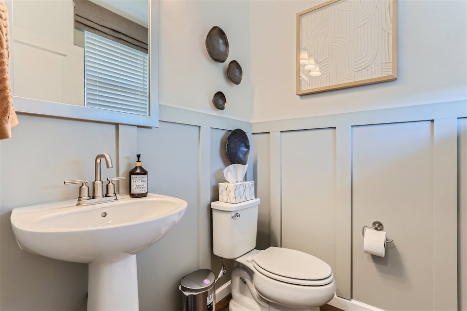 A bathroom with a toilet and sink.