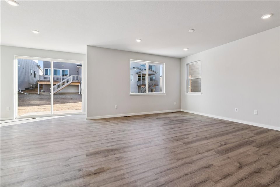 A room with a wood floor and a wood floor.