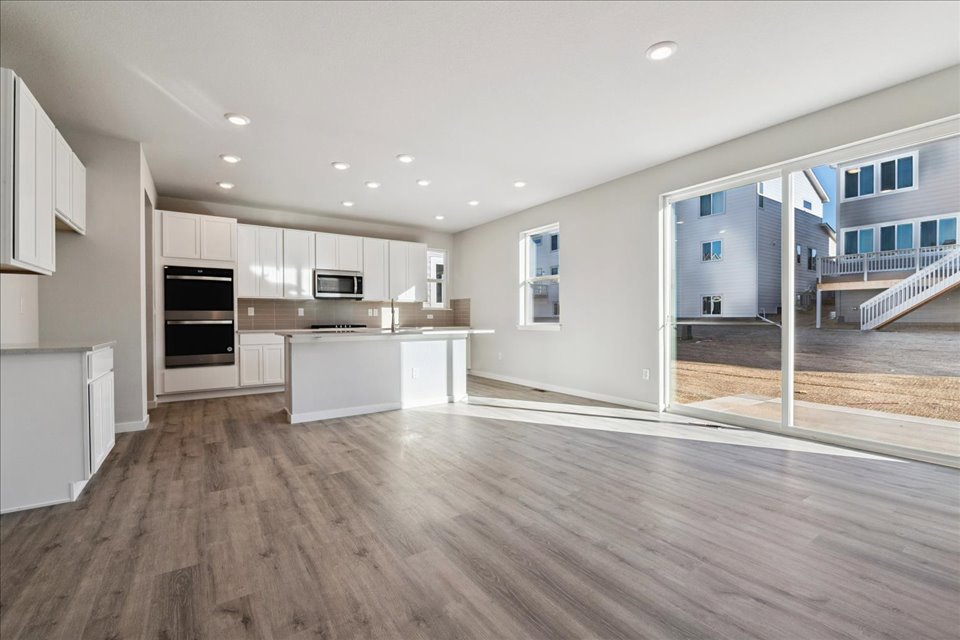 A large kitchen with white cabinets.