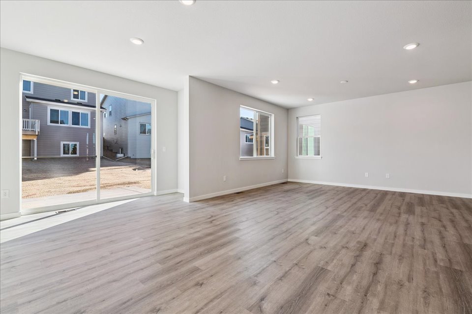 A room with a wood floor and a wood floor.