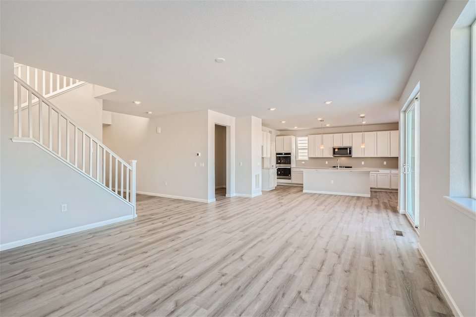 A long hallway with white walls.