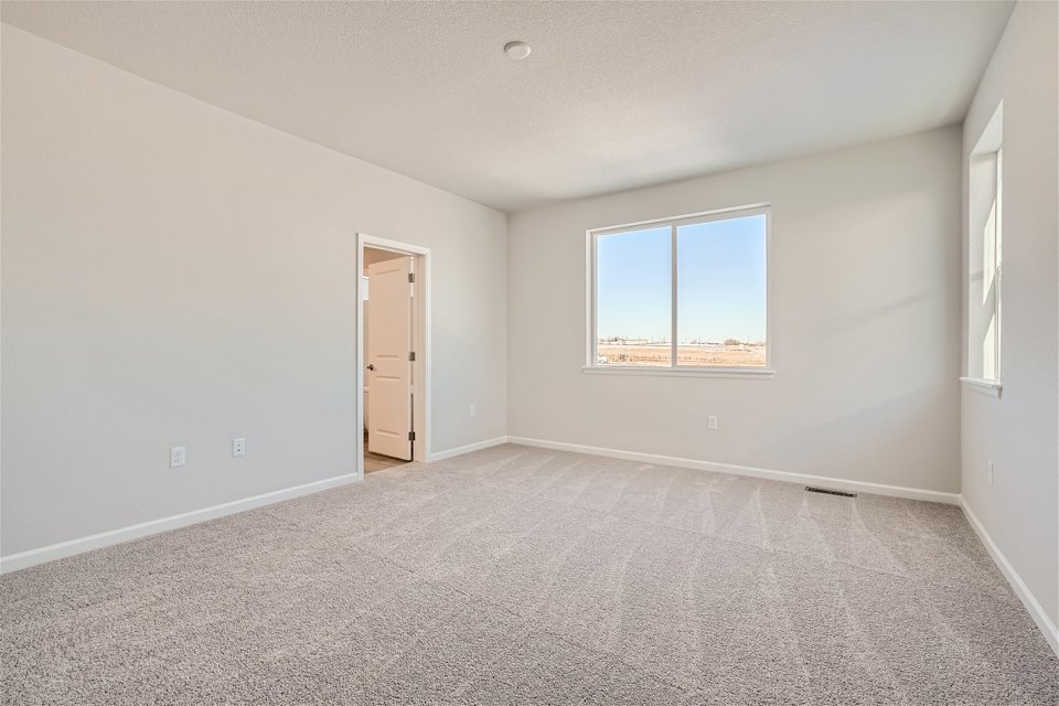 A room with a door and a window.