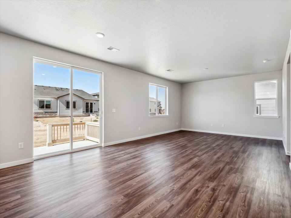A room with a wood floor and a wood floor.