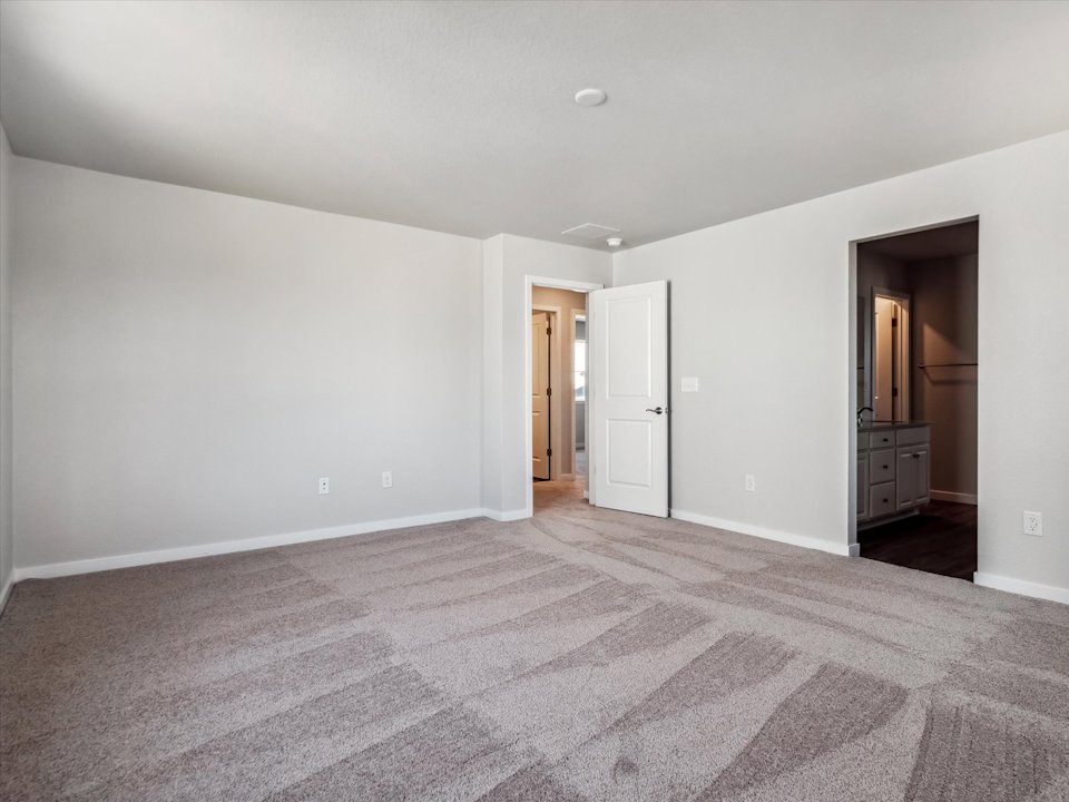 A room with a carpet and a rug.