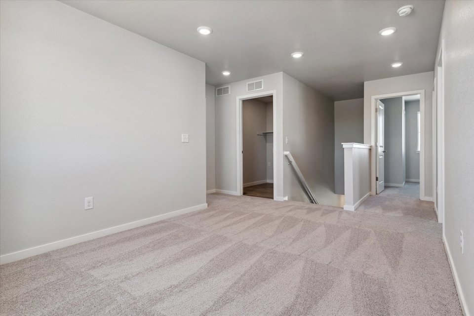 A hallway with white walls.