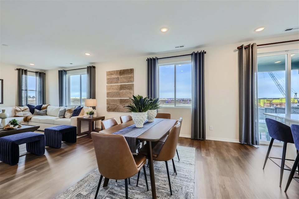 A large living room with a large glass door.