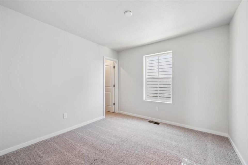 A room with a door and a window.