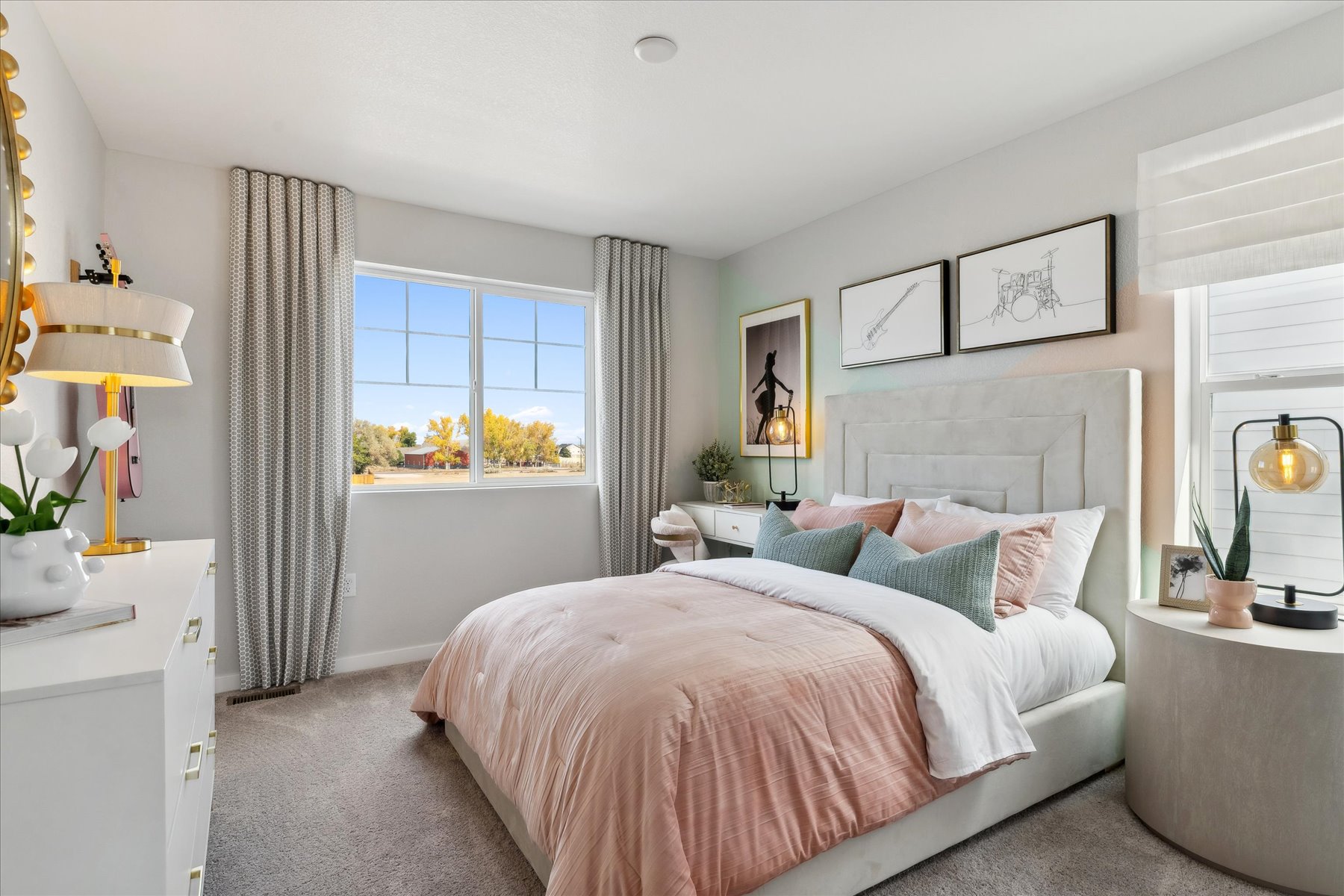 A bedroom with a bed and a window.