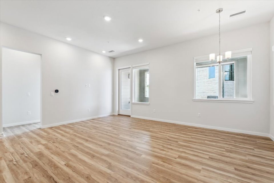 A room with a wood floor and a wood floor.