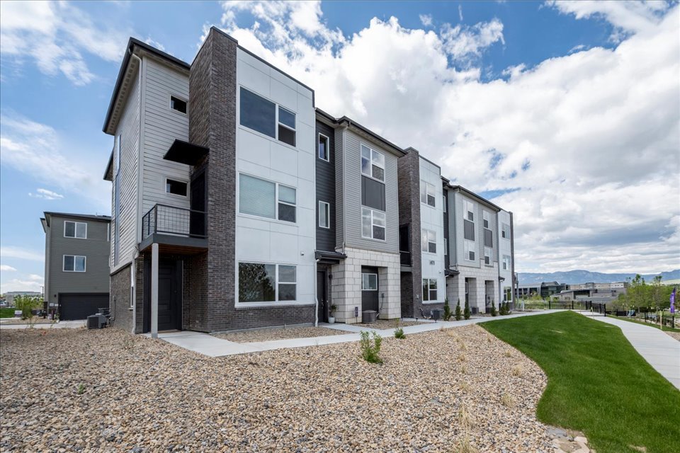 A building with a grass yard.